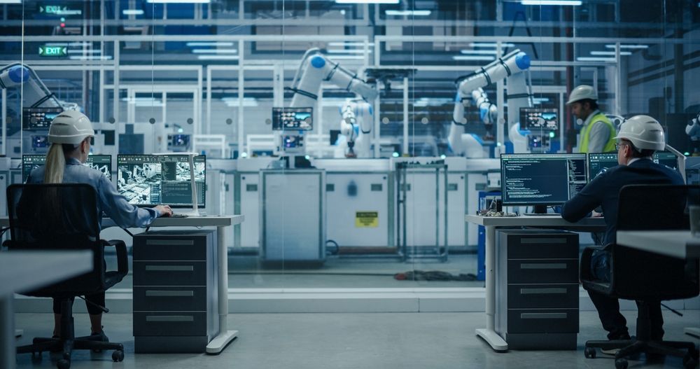 Establishing,Shot,At,An,Electronics,Factory,With,Robotic,Arms.,Diverse